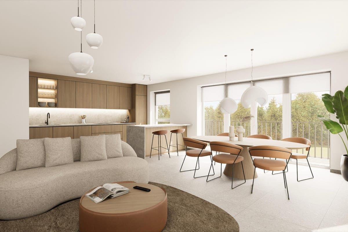 Cuisine ouverte aux façades en bois, îlot et séjour lumineux d'un appartement neuf
